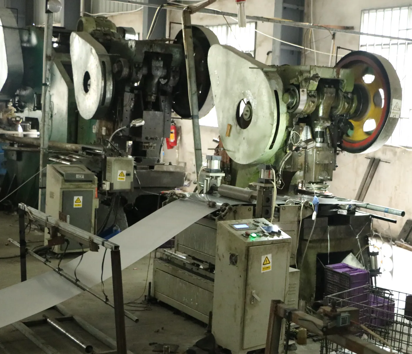 Automatic punch press line stamping stainless steel blanks in the Chufei workshop