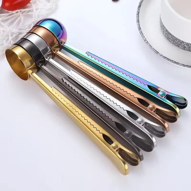 Kitchenware — coffee bean measuring spoons, oil spray bottles, and stainless cookware